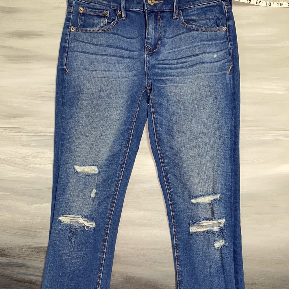 Express Jeans size 28 (about a 4) long, distressed in the front. Like new.